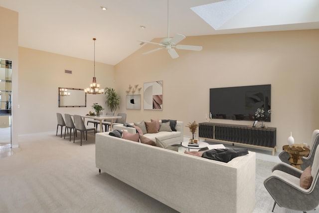 living area featuring a skylight, high vaulted ceiling, baseboards, ceiling fan with notable chandelier, and light carpet