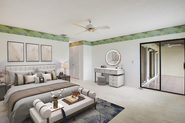 bedroom with visible vents, carpet flooring, and ceiling fan