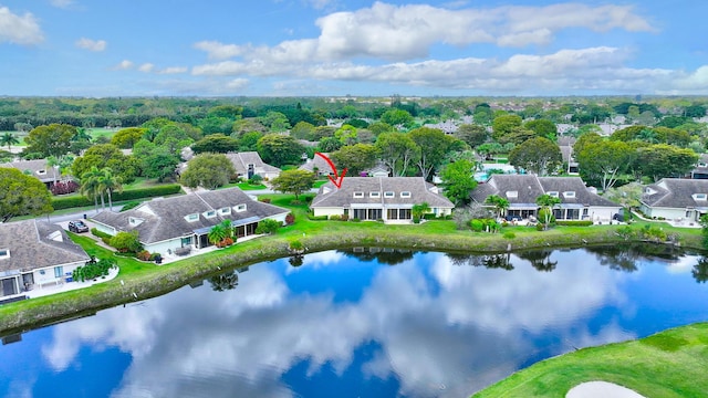 bird's eye view with a water view and a residential view