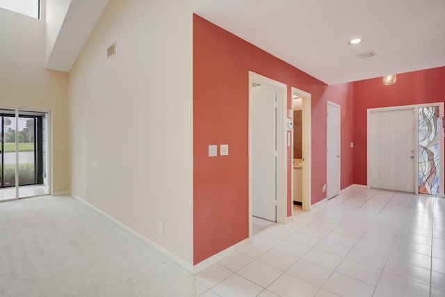 foyer with visible vents, recessed lighting, and baseboards
