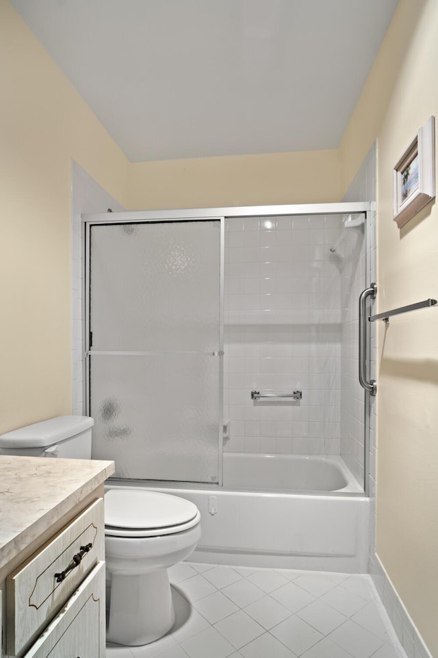 4810 NW 4th St Unit C, Delray Beach, FL 33445 - bathroom featuring combined bath / shower with glass door, tile patterned floors, toilet, and vanity