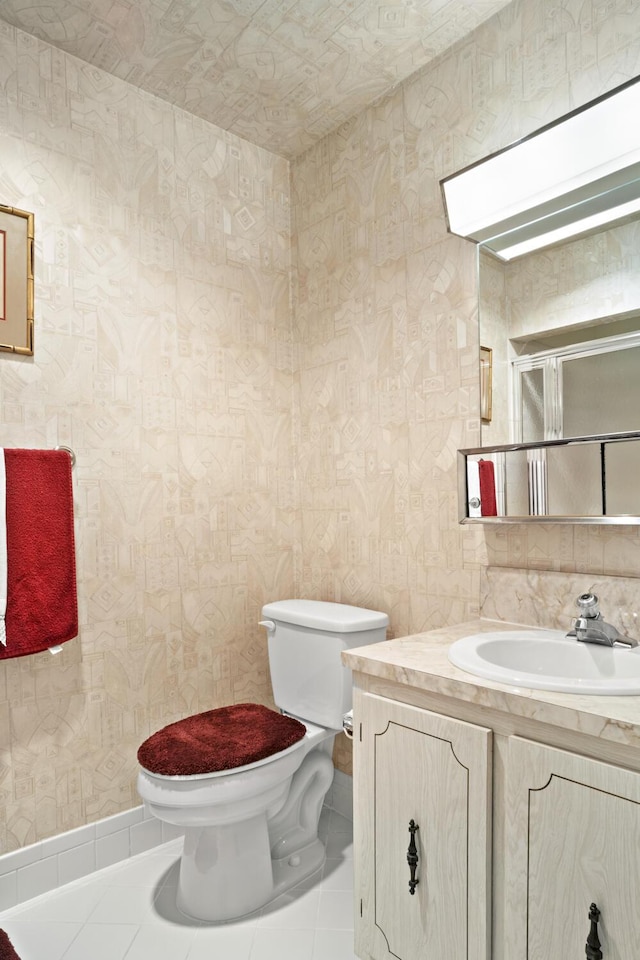 4810 NW 4th St Unit C, Delray Beach, FL 33445 - bathroom featuring wallpapered walls, toilet, tile patterned floors, and vanity