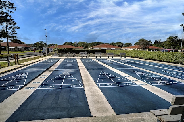 4810 NW 4th St Unit C, Delray Beach, FL 33445 - view of community featuring shuffleboard and uncovered parking