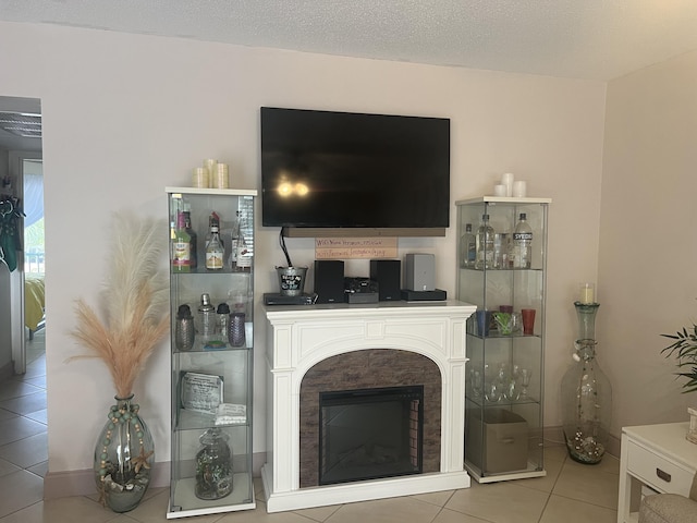 81 Flanders B B, Delray Beach, FL 33484 - tiled living area with a fireplace and a textured ceiling