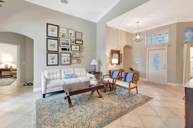 8353 Grand Messina Cir, Boynton Beach, FL 33472 - living area with ornamental molding, baseboards, arched walkways, and light tile patterned flooring