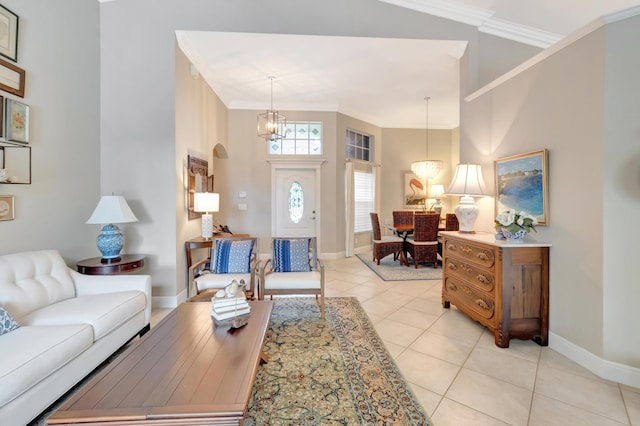 8353 Grand Messina Cir, Boynton Beach, FL 33472 - living area featuring a towering ceiling, a notable chandelier, baseboards, ornamental molding, and light tile patterned flooring