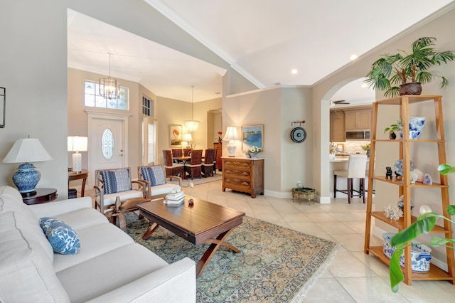8353 Grand Messina Cir, Boynton Beach, FL 33472 - living room with light tile patterned floors, baseboards, arched walkways, ornamental molding, and recessed lighting