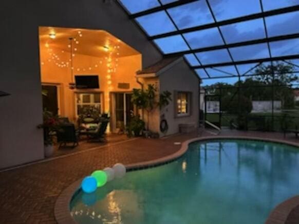 8353 Grand Messina Cir, Boynton Beach, FL 33472 - pool featuring a patio area and glass enclosure