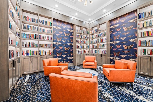 8353 Grand Messina Cir, Boynton Beach, FL 33472 - sitting room featuring built in features, recessed lighting, bookshelves, and wallpapered walls