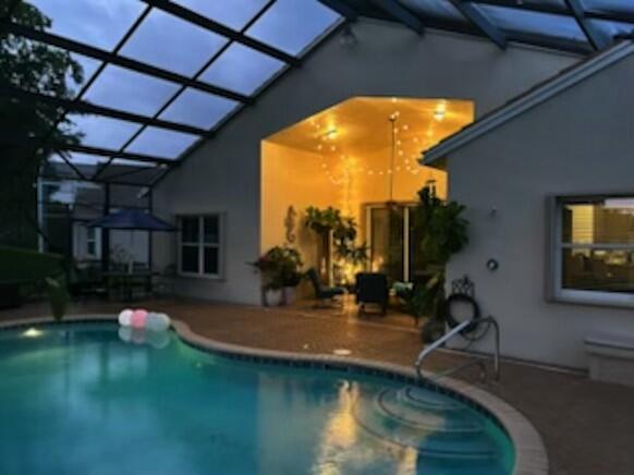 8353 Grand Messina Cir, Boynton Beach, FL 33472 - outdoor pool with a patio and a lanai