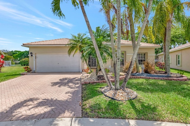 8353 Grand Messina Cir, Boynton Beach, FL 33472 - view of front of property with stucco siding, decorative driveway, an attached garage, a front yard, and a tiled roof