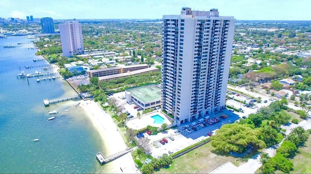 view of urban area featuring a nearby body of water and a pool