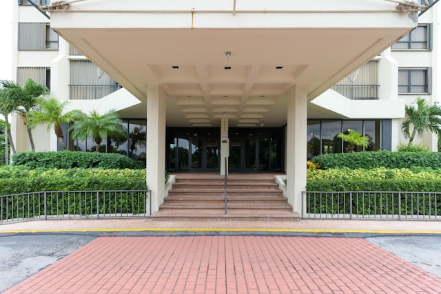 property entrance featuring uncovered parking