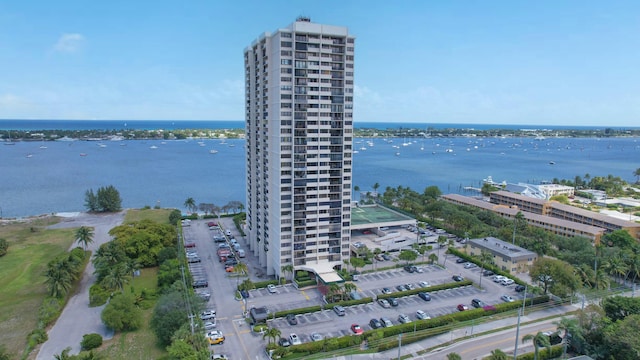 drone / aerial view of apartment complex / building and a nearby body of water