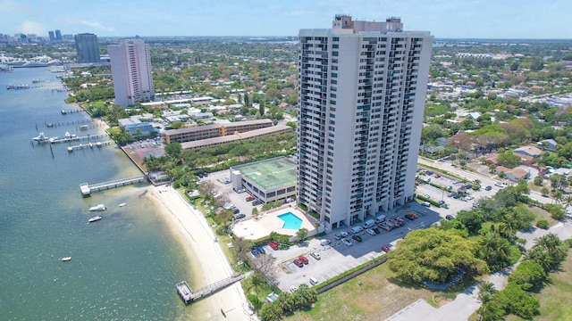 view of urban area with a nearby body of water and a pool area