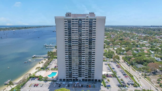 aerial view of apartment complex / building and a nearby body of water