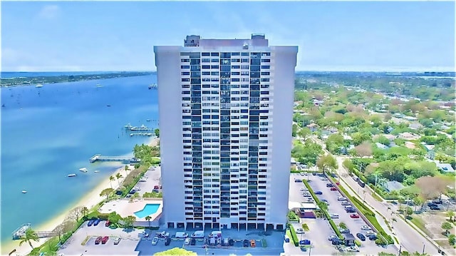 bird's eye view of apartment complex and a large body of water