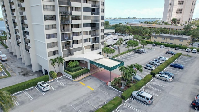 view of apartment building / complex with uncovered parking