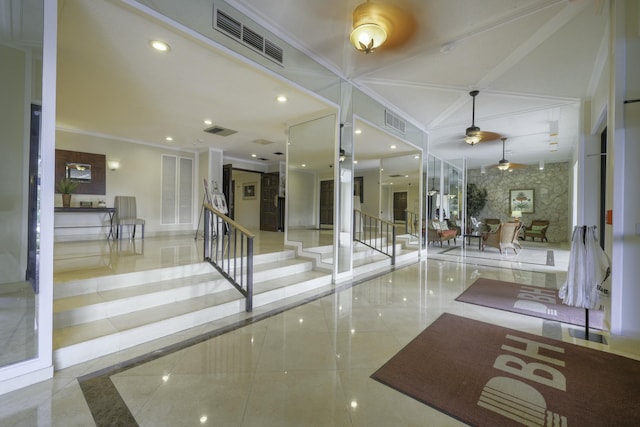 lobby featuring stairs and ornamental molding