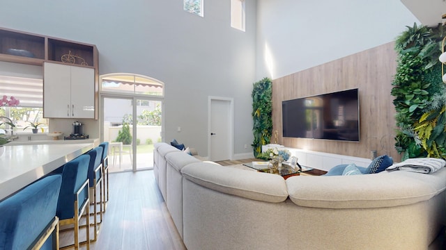 1942 NE 6th St, Deerfield Beach, FL 33441 - living area with a high ceiling and light wood-type flooring