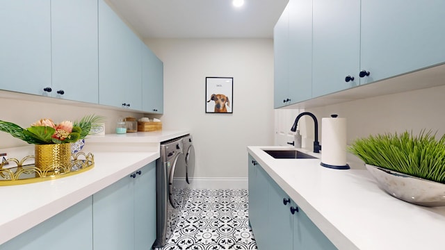 1942 NE 6th St, Deerfield Beach, FL 33441 - washroom with independent washer and dryer, baseboards, a sink, cabinet space, and light tile patterned floors