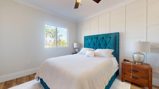 1942 NE 6th St, Deerfield Beach, FL 33441 - bedroom with baseboards, ceiling fan, and wood finished floors