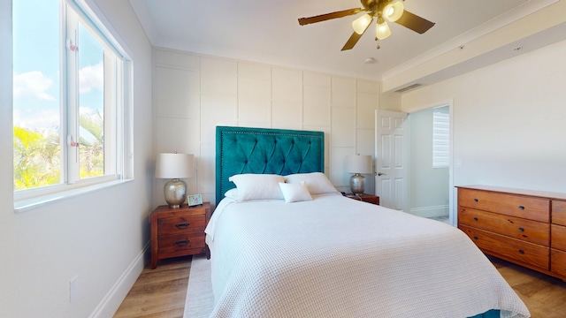 1942 NE 6th St, Deerfield Beach, FL 33441 - bedroom with baseboards, visible vents, light wood-style flooring, and a ceiling fan