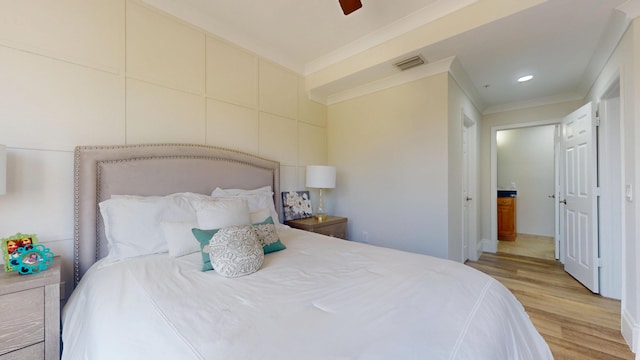 1942 NE 6th St, Deerfield Beach, FL 33441 - bedroom featuring light wood-style flooring, visible vents, ornamental molding, recessed lighting, and a ceiling fan