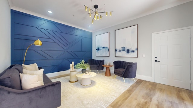 1942 NE 6th St, Deerfield Beach, FL 33441 - sitting room featuring crown molding, an accent wall, a chandelier, wood finished floors, and baseboards