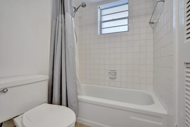 bathroom with toilet and shower / tub combo