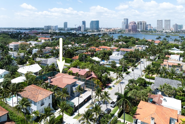 birds eye view of property featuring a residential view, a view of city, and a water view