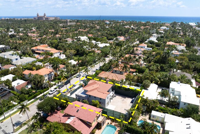 bird's eye view featuring a water view and a residential view