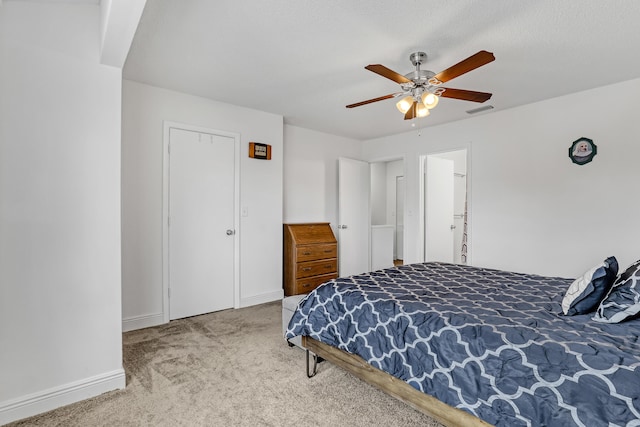 bedroom featuring baseboards, visible vents, ceiling fan, and carpet flooring