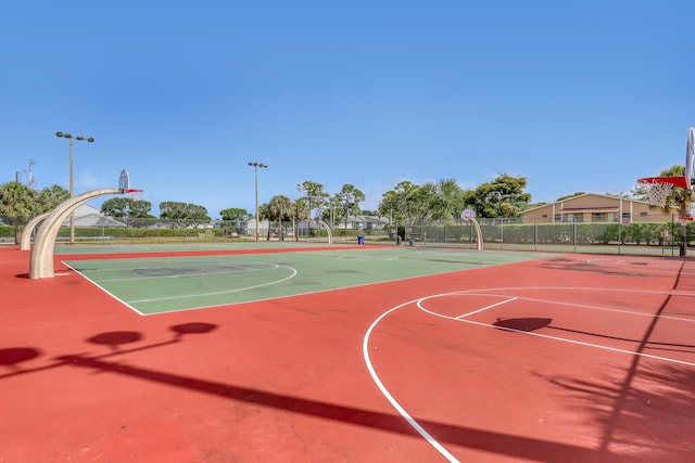 view of sport court featuring community basketball court and fence