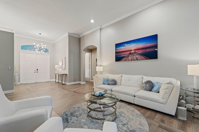 149 Sedona Way, Palm Beach Gardens, FL 33418 - living area with arched walkways, ornamental molding, a chandelier, baseboards, and wood finished floors