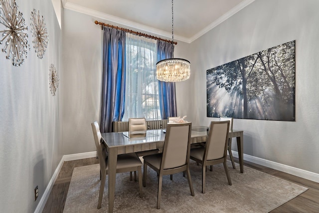 149 Sedona Way, Palm Beach Gardens, FL 33418 - dining area with a chandelier, baseboards, wood finished floors, and crown molding
