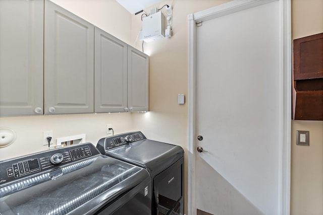 149 Sedona Way, Palm Beach Gardens, FL 33418 - laundry area featuring cabinet space and washing machine and dryer