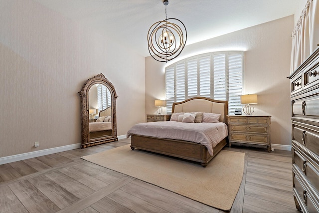 149 Sedona Way, Palm Beach Gardens, FL 33418 - bedroom with a chandelier, light wood-style flooring, and baseboards
