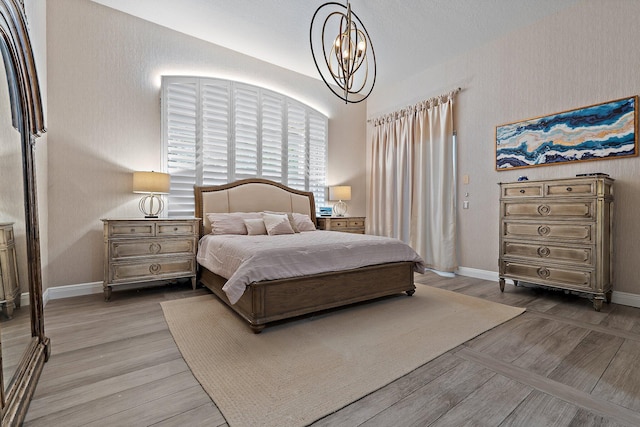 149 Sedona Way, Palm Beach Gardens, FL 33418 - bedroom featuring a chandelier, wood finished floors, and baseboards