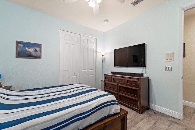 149 Sedona Way, Palm Beach Gardens, FL 33418 - bedroom featuring a closet, light wood-type flooring, baseboards, and a ceiling fan