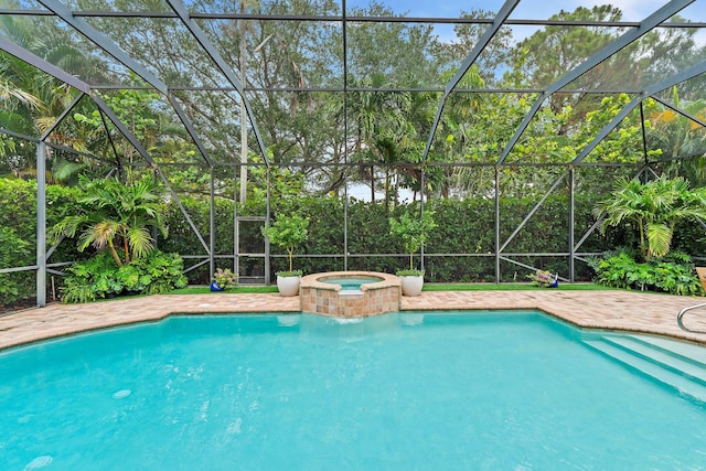 149 Sedona Way, Palm Beach Gardens, FL 33418 - view of swimming pool featuring glass enclosure and a pool with connected hot tub