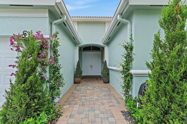 149 Sedona Way, Palm Beach Gardens, FL 33418 - property entrance featuring stucco siding