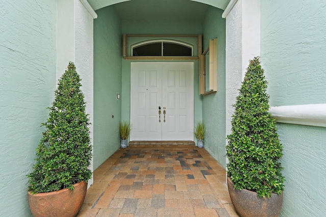 149 Sedona Way, Palm Beach Gardens, FL 33418 - doorway to property with stucco siding