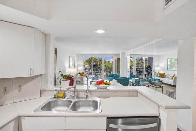 155 Isle Of Venice Dr Unit 304, Fort Lauderdale, FL 33301 - kitchen with appliances with stainless steel finishes, a sink, recessed lighting, light countertops, and white cabinetry