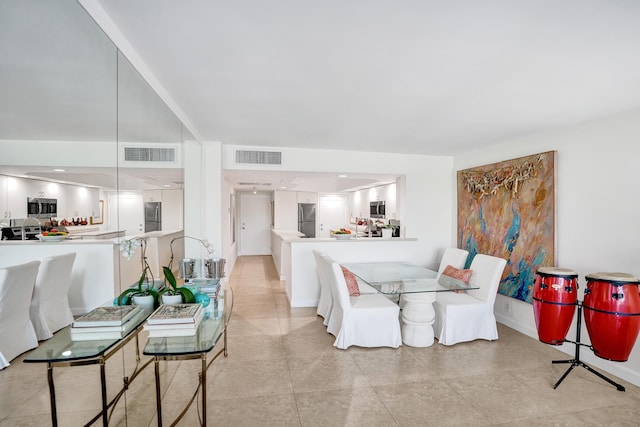 155 Isle Of Venice Dr Unit 304, Fort Lauderdale, FL 33301 - living room featuring baseboards and light tile patterned floors