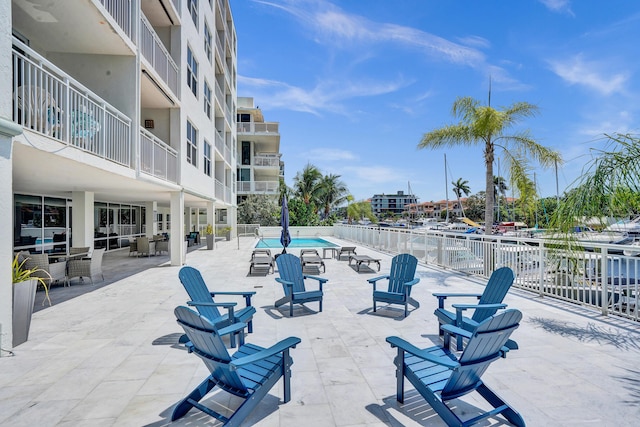 155 Isle Of Venice Dr Unit 304, Fort Lauderdale, FL 33301 - view of patio / terrace with a community pool and fence