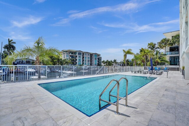 155 Isle Of Venice Dr Unit 304, Fort Lauderdale, FL 33301 - community pool with fence, an outdoor living space, and a patio