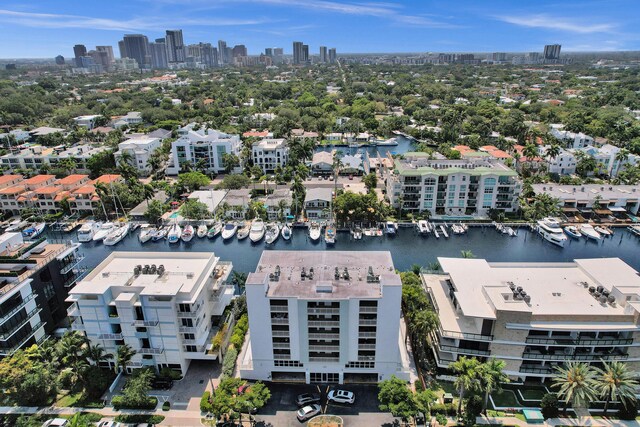 155 Isle Of Venice Dr Unit 304, Fort Lauderdale, FL 33301 - aerial view of a pool area, a nearby body of water, and apartment complex / building