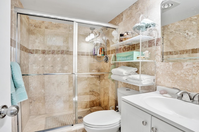 155 Isle Of Venice Dr Unit 304, Fort Lauderdale, FL 33301 - full bath featuring tile walls, a stall shower, toilet, and vanity