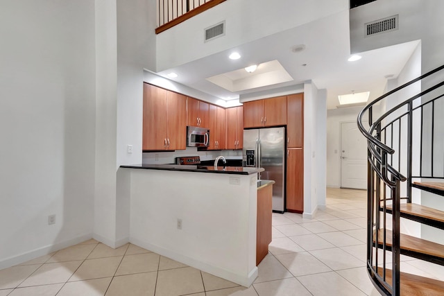 801 S Olive Ave Unit 127, West Palm Beach, FL 33401 - kitchen with dark countertops, visible vents, appliances with stainless steel finishes, and baseboards